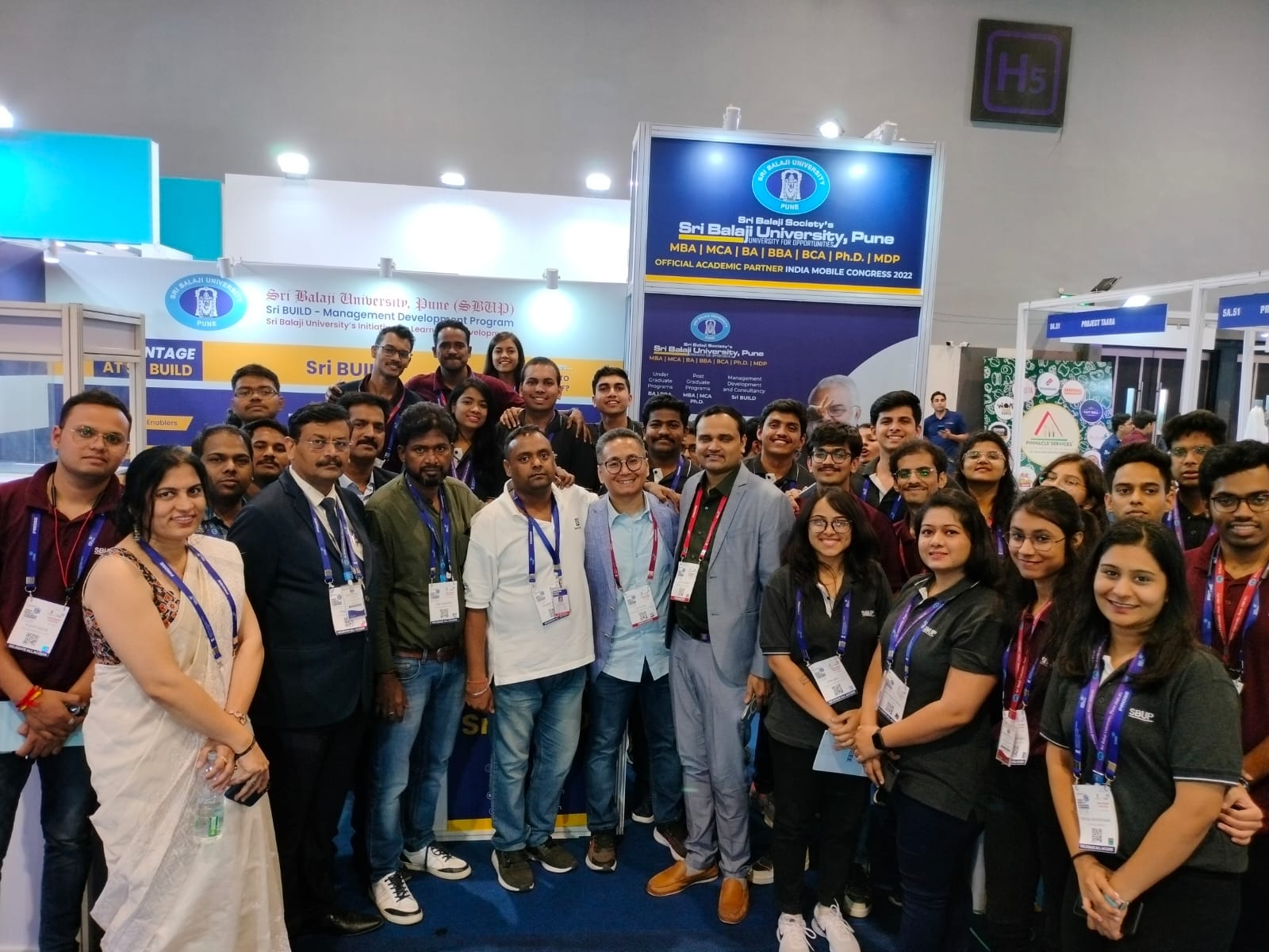 Sri Balaji University, Pune (SBUP) as the Official Academic Partner at #IMC2022. Seen here at the SBUP exhibition booth with MBA students, Faculty and Alumni
